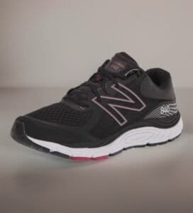 New Balance women's white leather slip-on walking shoe with supportive cushioning and a stable rubber outsole.